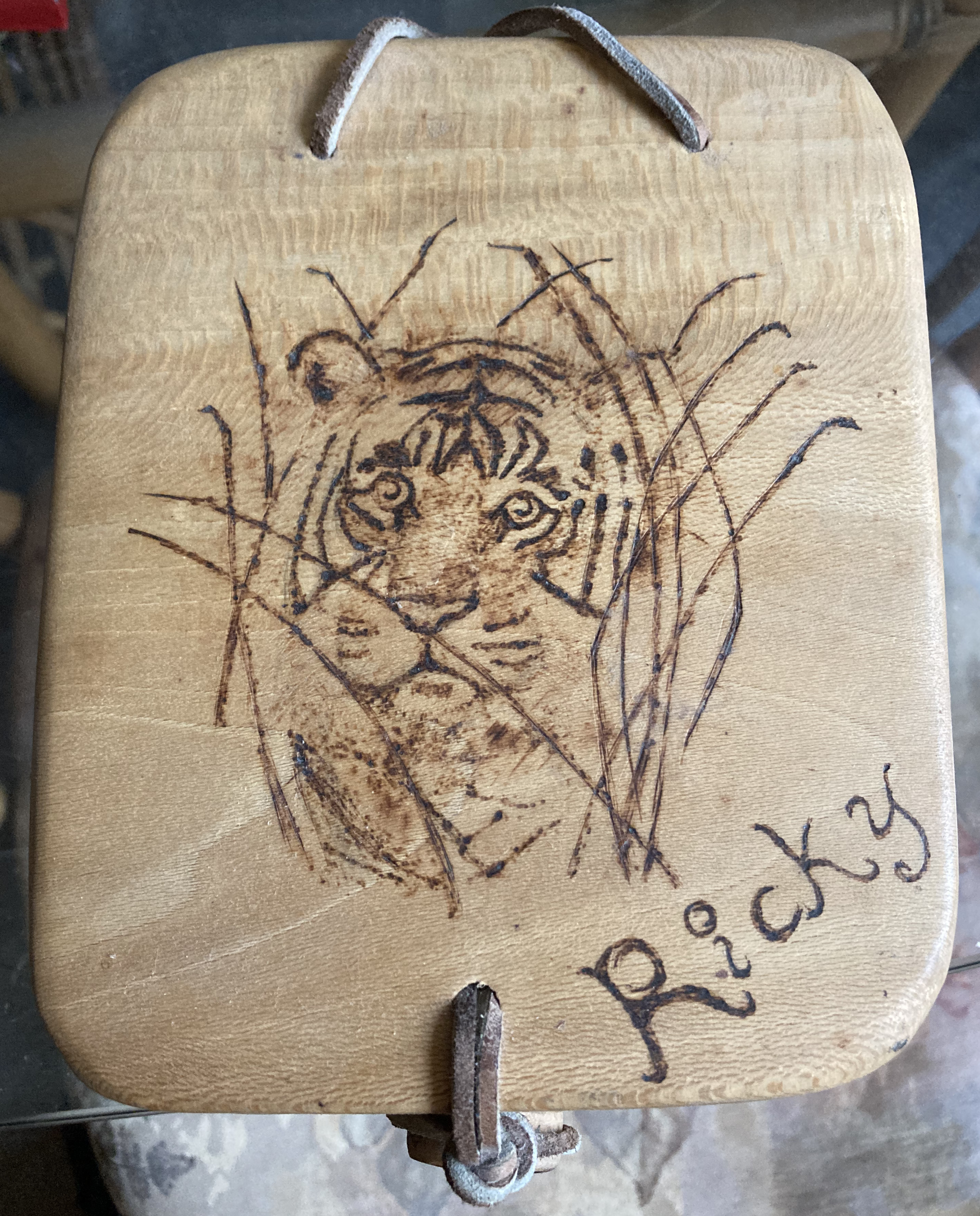 A Sycamore box with an image of a tiger burned in the lid.